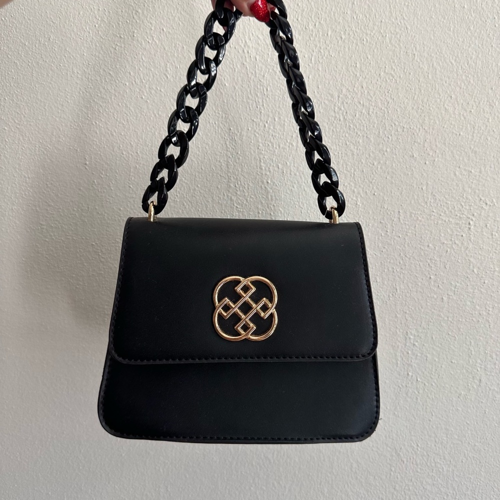 Chic Black Handbag with Gold Accent